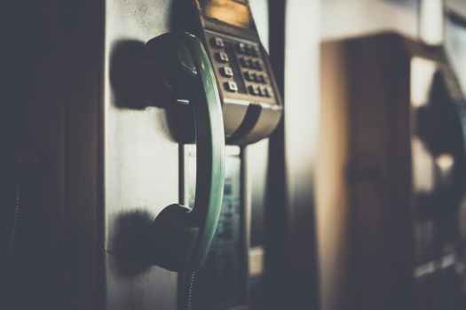 selective focus photo of green telephone